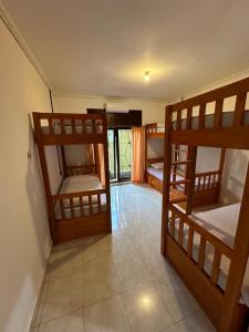 Postel nebo postele na pokoji v ubytování Rodin Bali Hostel