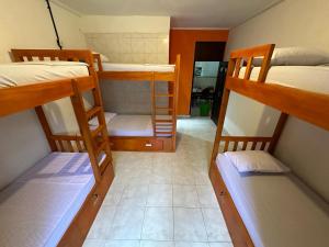 Postel nebo postele na pokoji v ubytování Rodin Bali Hostel