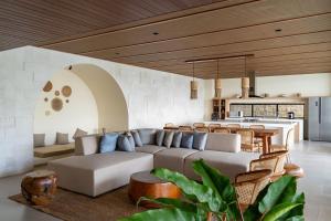 a living room with a couch and a kitchen at Jaden Hill Mountain City View Villa 8 Bedrooms With a Private Heated Swimming Pool and a Movie Room in Bengkok
