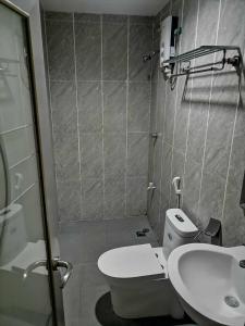 a small bathroom with a toilet and a sink at Asia Novo Boutique Hotel - Midsayap in Midsayap +30 photos