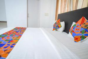 Katil atau katil-katil dalam bilik di FabExpress Nimalan Residency