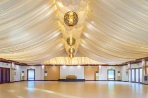 a large marquee with a ceiling and a stage at Sheridan Boutique Resort Iloilo in Iloilo City