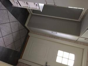 a garage door with a window on top of it at Holiday Home Lofoten in Lyngværet +18 photos