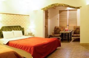 Ένα ή περισσότερα κρεβάτια σε δωμάτιο στο Asan Paradise