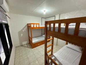 Postel nebo postele na pokoji v ubytování Rodin Bali Hostel