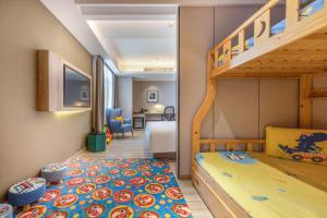a childs bedroom with a bunk bed and a ladder at Atour Hotel Presidential Residence Nanjing in Nanjing +87 photos