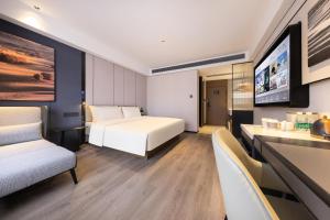 Postel nebo postele na pokoji v ubytování Atour Hotel Guangzhou Baiyun Jiahe Hebian