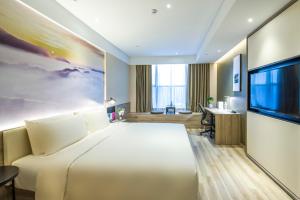Letto o letti in una camera di Atour Hotel Foshan Nanhai Qiandeng Lake Guicheng