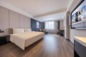 Postel nebo postele na pokoji v ubytování Atour Hotel Guangzhou Baiyun Jiahe Hebian