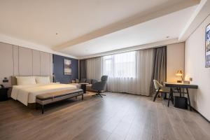 Postel nebo postele na pokoji v ubytování Atour Hotel Guangzhou Baiyun Jiahe Hebian