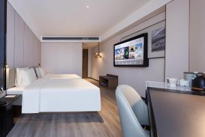 Postel nebo postele na pokoji v ubytování Atour Hotel Guangzhou Baiyun Jiahe Hebian
