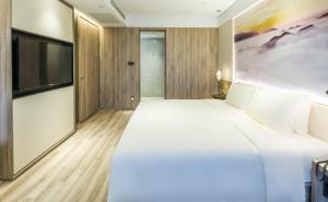 Letto o letti in una camera di Atour Hotel Foshan Nanhai Qiandeng Lake Guicheng