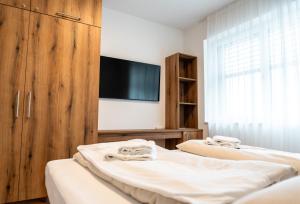 Ένα ή περισσότερα κρεβάτια σε δωμάτιο στο Bella Vista Seeblick