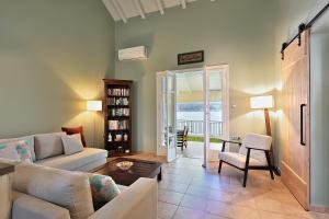 a living room with a couch and a table at Villa Pelagos in Asos