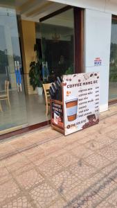 a box sitting on the ground in front of a store at Hương Giang Hotel & Coffee in Thái Bình