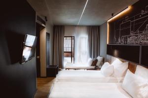 Postel nebo postele na pokoji v ubytování Hotel M23