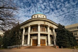 a large building with a tower on top of it at Nadezhda Apartments on Nayryzbay batyr 82 in Almaty