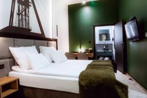 Postel nebo postele na pokoji v ubytování Hotel M23
