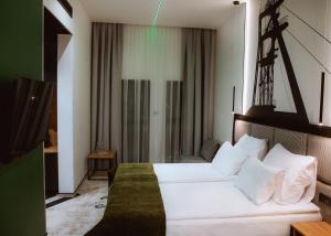 Postel nebo postele na pokoji v ubytování Hotel M23
