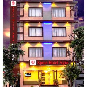 a building with a blue light on the side of it at Spree Hotel Agra - Walking Distance to Tajmahal in Agra