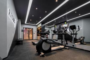 a gym with two treadmills and a treadmill at Atour Hotel Ningbo Zhenhai New City in Ningbo