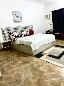 a bedroom with a bed in a room at APARTMENT 30A in Abuja