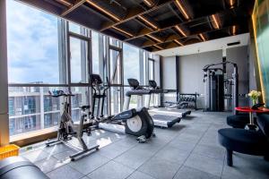 a gym with treadmills and cardio equipment in a building at Atour S Hotel Ningbo Binjiang Olympic Sports Center in Ningbo