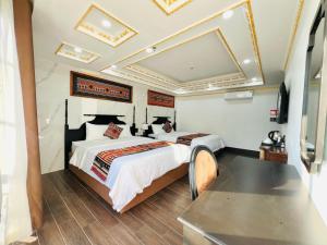 Postel nebo postele na pokoji v ubytování Trung Huyền Hotel