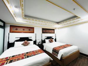 Postel nebo postele na pokoji v ubytování Trung Huyền Hotel