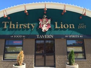 a building with a sign that reads thiriny lion at Park West Inn in Saint James