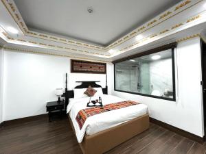 Postel nebo postele na pokoji v ubytování Trung Huyền Hotel
