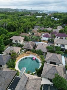 an aerial view of a resort town with a swimming pool at Mai Villa in Jimbaran