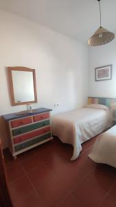 Postel nebo postele na pokoji v ubytování Chalet Matalascañas