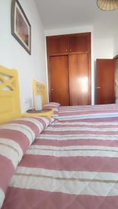 Postel nebo postele na pokoji v ubytování Chalet Matalascañas