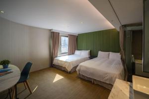 Finders Hotel-Fu Qian客房内的一张或多张床位