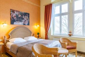 Ένα ή περισσότερα κρεβάτια σε δωμάτιο στο Schlossberg-Hotel Garni