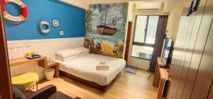 Postel nebo postele na pokoji v ubytování Go Home Homestay