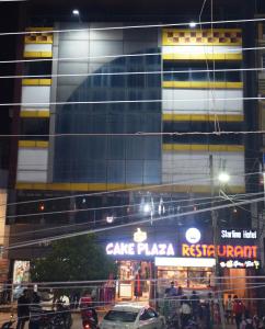 a building with a pizza restaurant in front of it at Starline Hotel in Agartala
