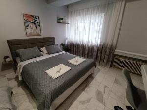 A bed or beds in a room at Callisto studio
