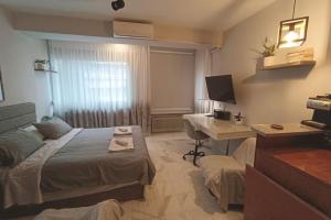 A bed or beds in a room at Callisto studio