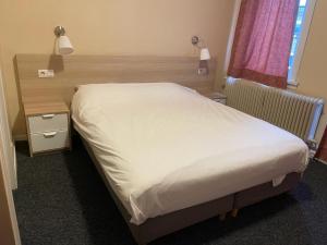 Letto o letti in una camera di Hotel Bristol Internationaal