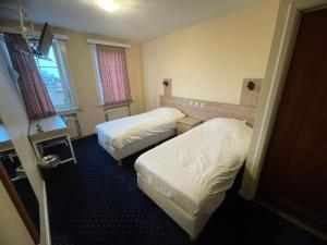 Letto o letti in una camera di Hotel Bristol Internationaal