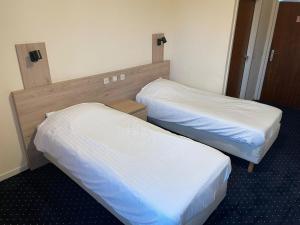 Letto o letti in una camera di Hotel Bristol Internationaal