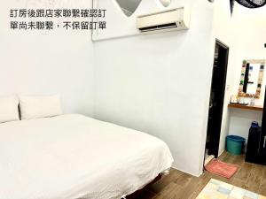 Postelja oz. postelje v sobi nastanitve Nanwan254 Homestay