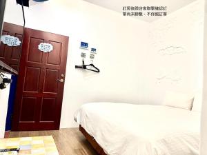 Postelja oz. postelje v sobi nastanitve Nanwan254 Homestay