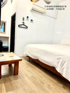 Postelja oz. postelje v sobi nastanitve Nanwan254 Homestay
