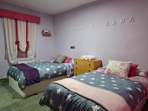Ένα ή περισσότερα κρεβάτια σε δωμάτιο στο Casa Paloma