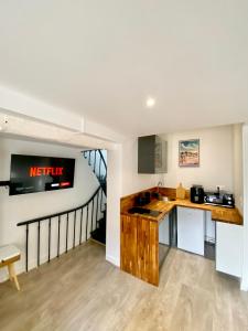 a kitchen with a sink and a counter top at Le Duplex Rouen Cocooning Rouen Centre Parking in Rouen