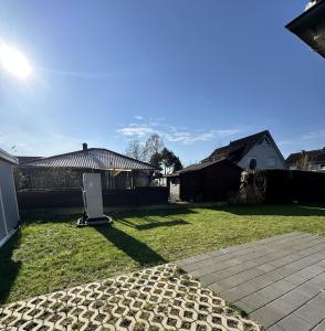 a yard with a refrigerator in the grass at Fewo am Tillysee in Wardenburg in Wardenburg +34 photos