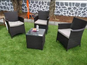 a group of chairs and a table on the grass at BnBBuddy- Great Escape@Karjat, Maharashtra in Karjat